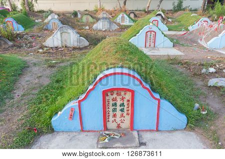 CHONBURI, THAILAND - APRIL 2 : The graveyard at Jing Gung Cemetery for Ancestor Worshipping and Sacrificial offering in the Qingming Festival on April 2, 2016 at Chonburi Thailand.