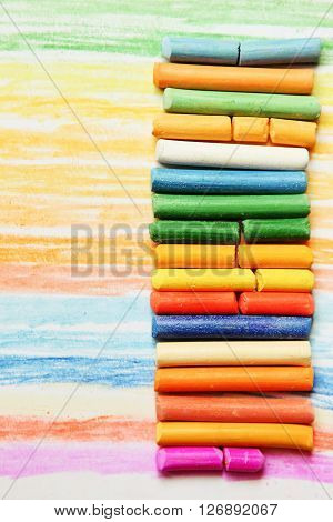 The colored dry postels close up background.