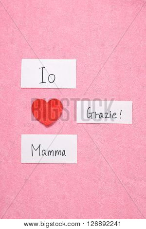 I Love Mom concept in Italian.
Red heart and hand written letters spelling I Love thank you mom concept in Italian.