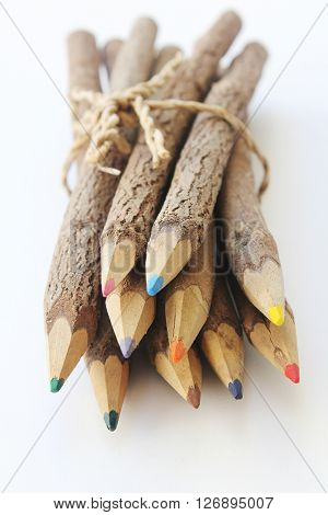 Brown wooden pencils isolated on white baclground.