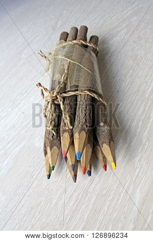 Wooden pencils on a white wooden table.