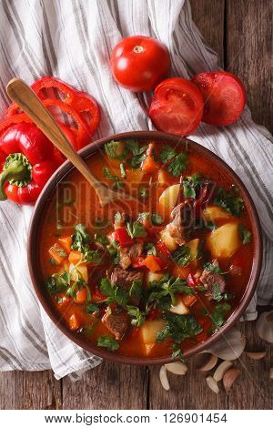 Traditional Hungarian Goulash Soup Bogracs Close-up In A Bowl. Vertical Top View