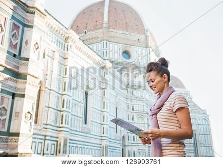 Happy Woman Tourist Looking At The Map In Florence, Italy