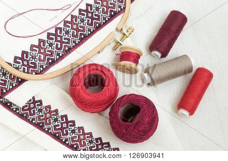Fragment of embroidery on linen and accessories