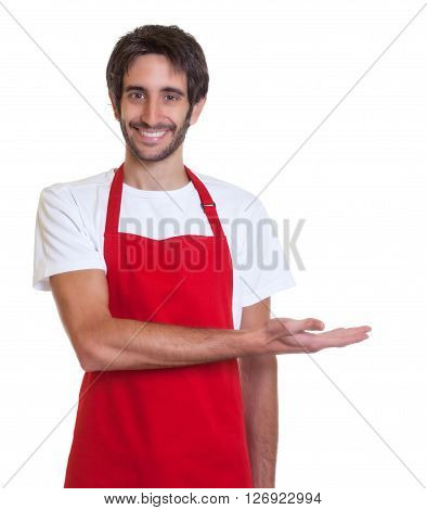 Laughing barkeeper presents somethingon an isolated white background for cut out