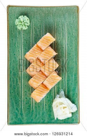 Sushi rolls withsalmon on a plate with wasabi and ginger. Top view. Isolated on white background. Include clipping path.