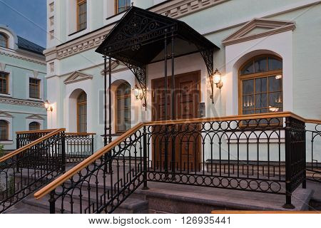 The entrance of the refectory in luxury classic style. Stairs railing canopy
