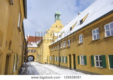 Augsburg Germany - January 17 2016:The Fuggerei is the world's oldest social housing complex still in use. It is a walled enclave within the city of Augsburg Bavaria.