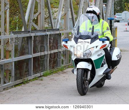 PILSEN CZECH REPUBLIC - APRIL 23, 2016: Czech policeman driving on Honda Pan European motorcycle. Liquid-cooled engine 1,261 cc, maximal speed is 225 km/h, weight 286 kg.