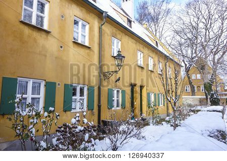 Augsburg Germany - January 17 2016:The Fuggerei is the world's oldest social housing complex still in use. It is a walled enclave within the city of Augsburg Bavaria.