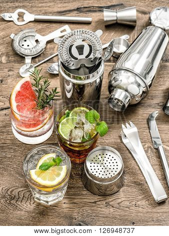 Cocktails with fruits and ice. Bar drink making tools