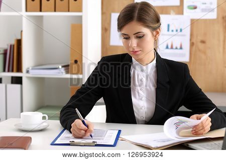 Beautiful Businesswoman Sit At Workplace In Office