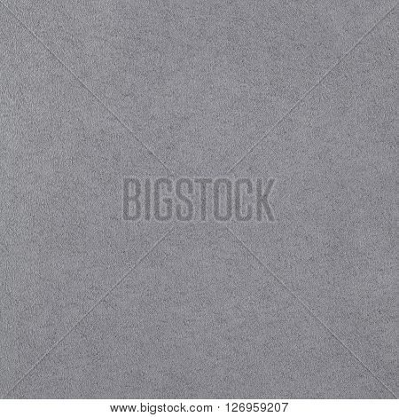 Grey suede leather texture. Close up top view.