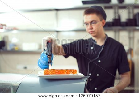 Cooks Preparing Sushi