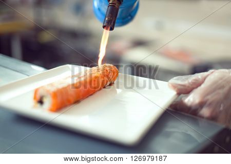 Cooks Preparing Sushi