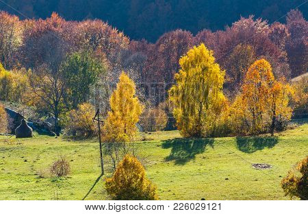 Dirty Secondary Road To Mountain Pass In Autumn Carpathian Mountains And Multicolored Yellow-orange-