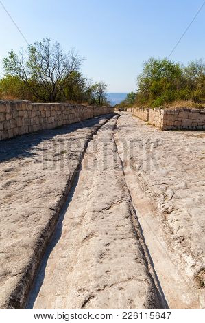 Road In The Rock And Deep Gauge From The Medieval Transport In Medieval Cave City-fortress Chufut-ka