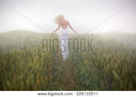 Beautiful Slim Blonde Woman Plays In White Dress, Fogy Meadow, Outdoor