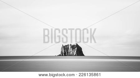 The Small Promontory Of Strombolicchio From Stromboli. Long Exposure Photography