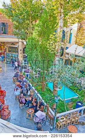 Isfahan, Iran - October 20, 2017: The Small Food Court With Garden And Fountain Is Located In Yard O