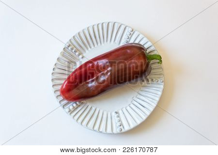 White Plate With Ripe Red Capsicum Annuum Cubanelle Pepper, Cuban Pepper, Italian Frying Pepper,  Fo