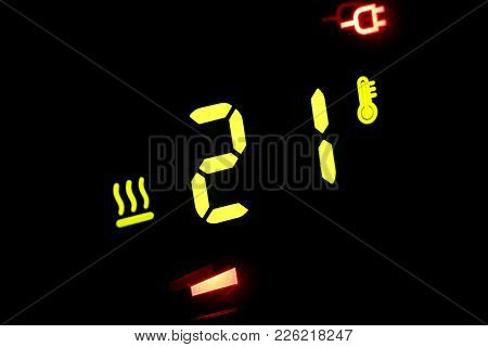 On A Black Electronic Thermometer Display -21 Degrees Celsius
