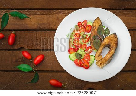 Grilled Fish Steak With Vegetables On Plate: Tomatoes, Microgran, Cucumber, Tasty And Healthy Dinner