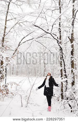 Beautiful Young Girl In A White Winter Forest