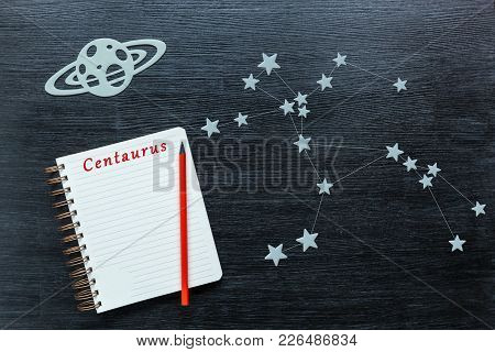 Zodiacal Star, Constellations Centaurus On A Black Background With A Notepad And Pencil.