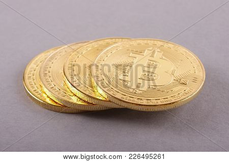 Golden Coin As A Symbol Of Bitcoin Crypto Currency Isolated On The Gray Background