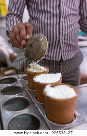 Indian popular dairy drink Lassi made of yogurt, sugar and water sold in the street shop in Vrindavan, Utar Pradesh, India