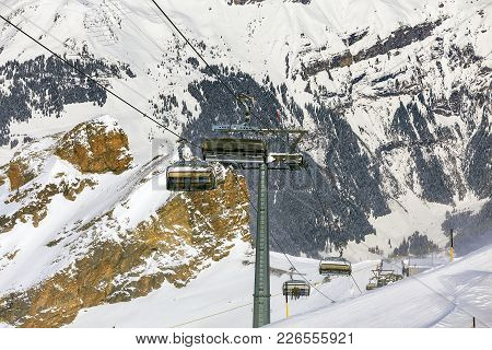 An Overhead Cable Car On Mt. Titlis In Switzerland. The Titlis Is A Mountain, Located On The Border 