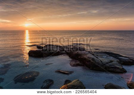 Sea Sunrise At The Black Sea Coast Near Ravda, Bulgaria. Rocky Sunrise.