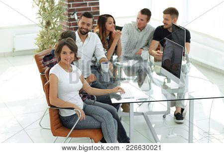 group of young employees discussing ideas