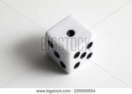 Dice Shot Up Close On A White Background, One