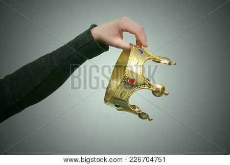Male Hand Throws Out The Crown. Abandonment Of Power. Resign. Loss Of Authority Concept. Lose Vip St