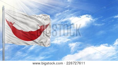 Flag Of Easter Island Rapa Nui On Flagpole Against The Blue Sky.