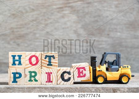 Toy Forklift Hold Letter Block E To Complete Word Hot Price On Wood Background