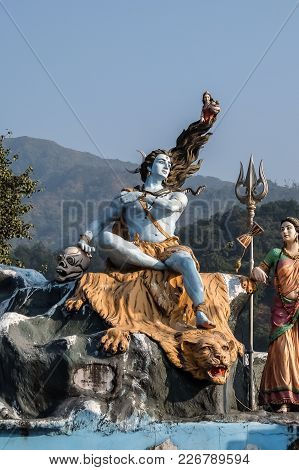 Rishikesh, India - December, 07th, 2016. Shiva Statue At The Ganga River Embankment In Rishikesh