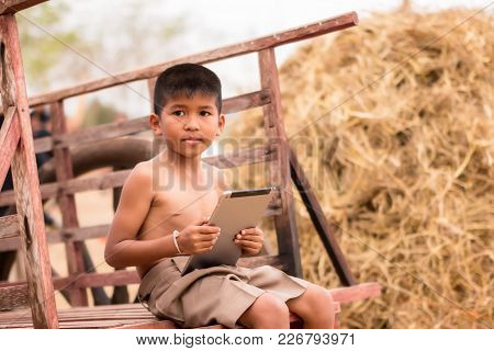 Rural Students Are Learning From Their Laptop On The Backyard. Technology Is Vital To Education, Eve