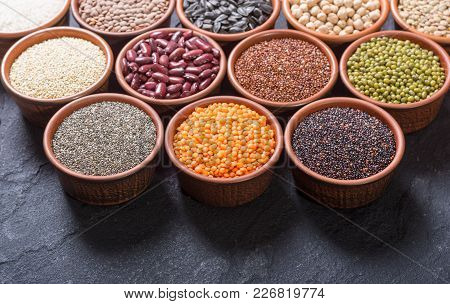 Mix Of Cereals And Beans In Bowl . Kinoa , Lentils , Chia , Chickpeas , Sunflowers .