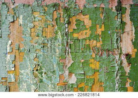 A Large Textured Background The Old Yellow Board Is Covered With Green Paint. Exfoliating Green Pain