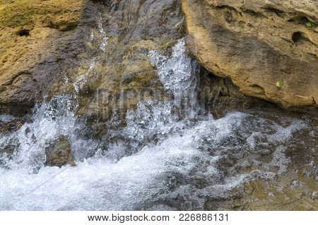 Running On Stones Water, Spray And Foam In A Narrow Bed, Strong Pressure And Fluid Velocity. Forest 