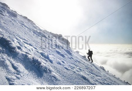 A Climber Rises Above The Cloud Layer As They Make The Journey Up Ngauruhoe, A Mountain On The North