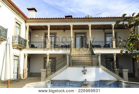 Amarante, Portugal - September 23, 2017: Classic House With Verandah, Granite Staircase And Water Fe