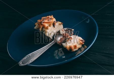 Curd Cake In A Plate Lies On A Wooden Background