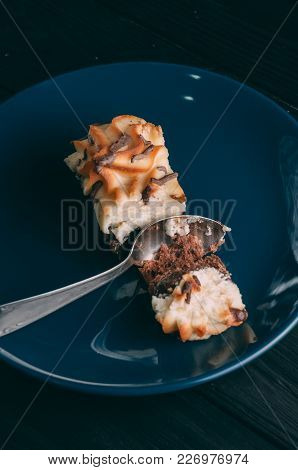 Curd Cake In A Plate Lies On A Wooden Background
