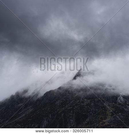 Stunning Detail Landscape Images Of Snowcapped Pen Yr Ole Wen Mountain In Snowdonia During Dramatic 