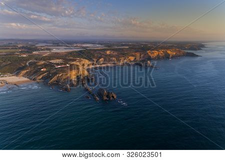 Aerial View Of The Beautiful Alteirinhos Beach At Zambujeira Do Mar, Alentejo, At Sunset