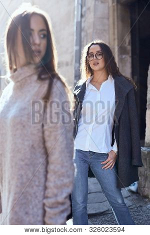 Unhappy Lgbt Lesbian Couple In The Street Of The City. Dissapointed Beautiful Brunette Woman In Quar